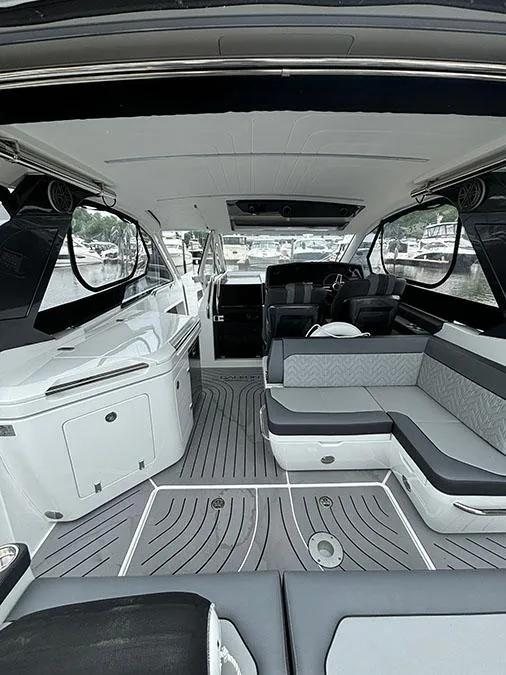 Slide: The Image of Interior of 2024 Galeon 325 GTO luxury yacht with modern seating and sleek design. - 9