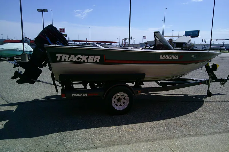Slide: The Image of 1989 Bass Tracker Pro Deep V-17 boat on trailer in parking lot. - 4