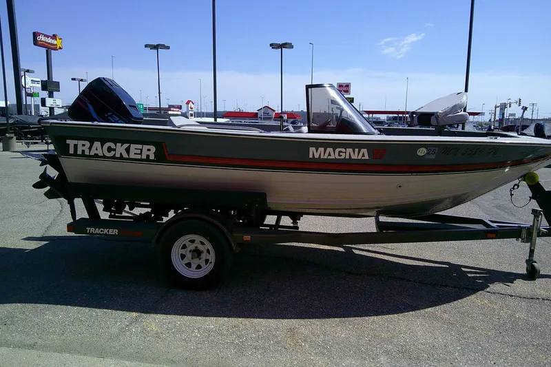 Slide: The Image of 1989 Bass Tracker Pro Deep V-17 boat on trailer in parking lot. - 6