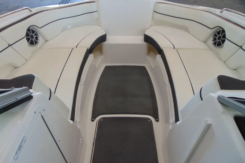 Slide: The Image of Interior of 2014 Yamaha AR210 boat with white seating and black accents. - 11