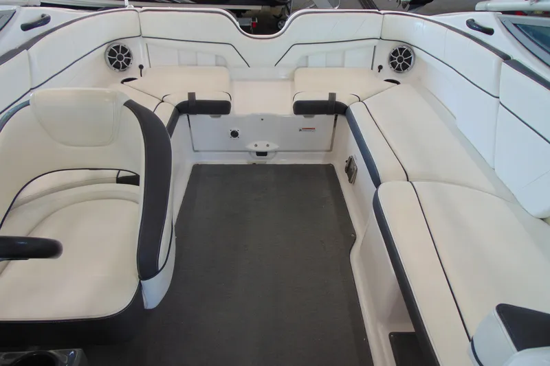 Slide: The Image of 2014 Yamaha AR210 boat interior with white seating and black accents. - 12