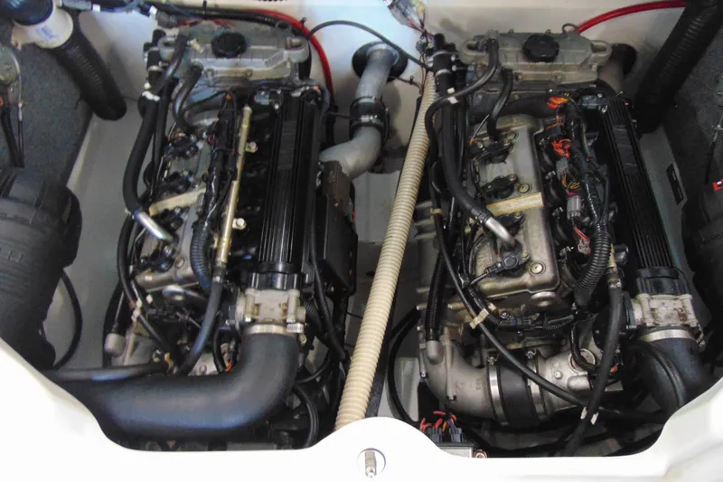 Slide: The Image of 2014 Yamaha AR210 boat engine compartment with dual engines and visible components. - 15