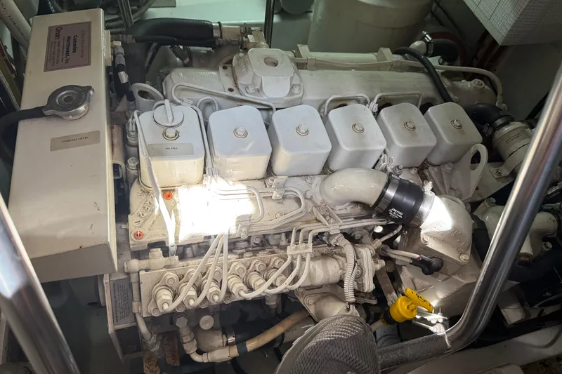 Slide: The Image of Engine room of a 2003 American Tug 34, showcasing detailed mechanical components. - 21