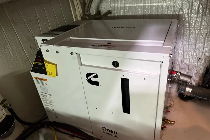 Slide: The Image of Onan Marine QD generator in a 2003 American Tug 34 engine room. - 22