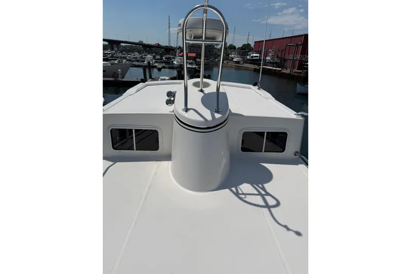 Slide: The Image of 2003 American Tug 34 boat deck with marina background. - 24