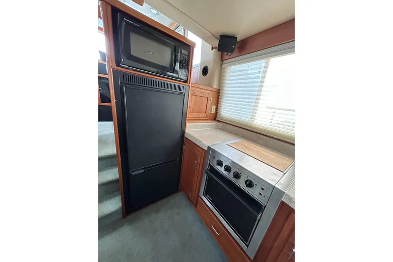 Slide: The Image of Interior kitchen of 2003 American Tug 34 with appliances and cabinetry. - 7