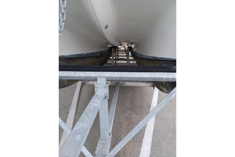 Slide: The Image of 2008 Glacier Bay 2270 Isle Runner boat on trailer, underside view. - 11