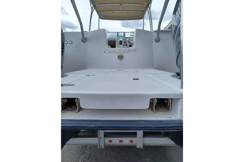 Slide: The Image of 2008 Glacier Bay 2270 Isle Runner boat, rear view with branding visible. - 13
