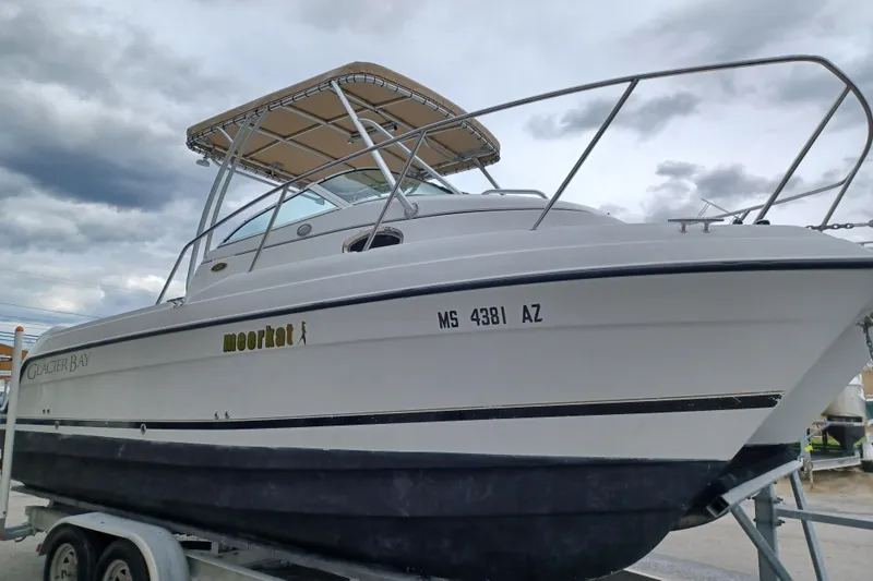Slide: The Image of 2008 Glacier Bay 2270 Isle Runner boat on trailer under cloudy sky. - 3