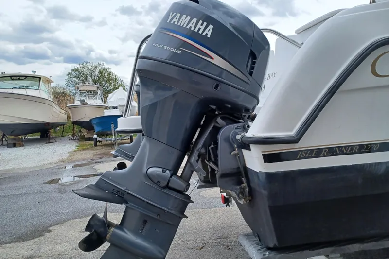 Slide: The Image of 2008 Glacier Bay 2270 Isle Runner with Yamaha outboard motor in a boatyard. - 4
