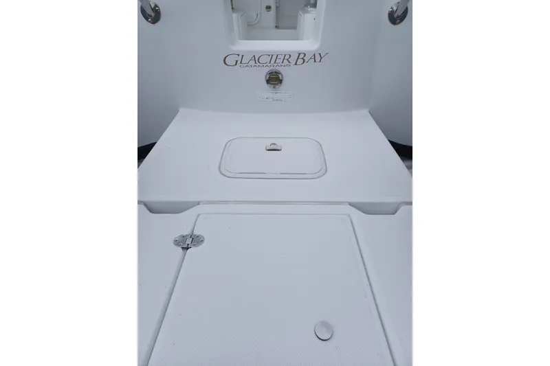 Slide: The Image of 2008 Glacier Bay 2270 Isle Runner catamaran deck with storage compartments. - 5