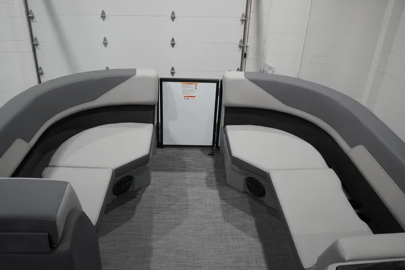 Slide: The Image of Interior of 2026 Lowe LS 190 boat with gray seating and carpeted floor. - 21