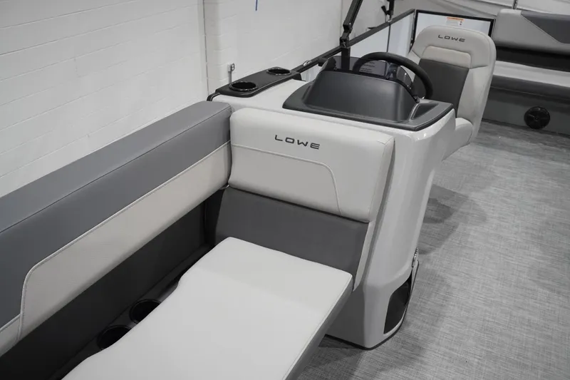 Slide: The Image of 2026 Lowe LS 190 boat interior with modern seating and steering console. - 23