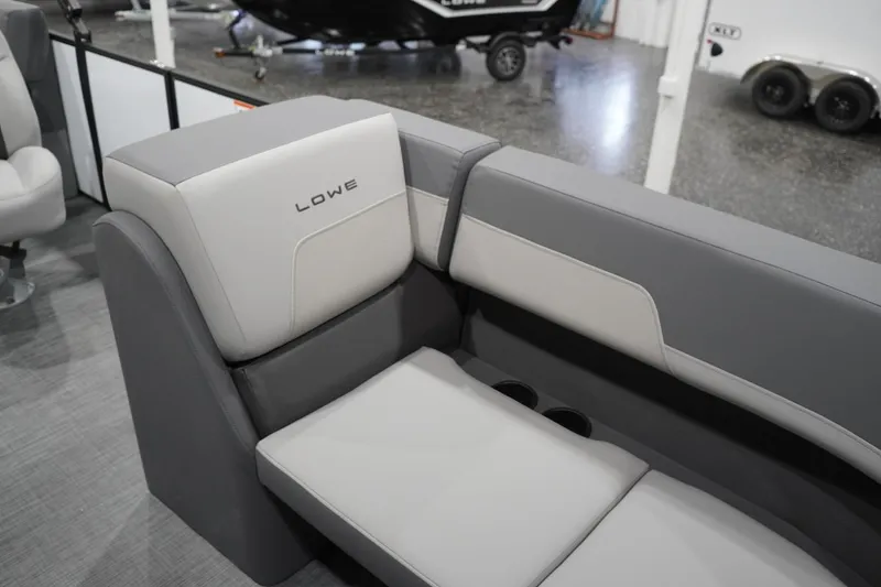 Slide: The Image of Gray and white seating on 2026 Lowe LS 190 boat, featuring cup holders. - 24