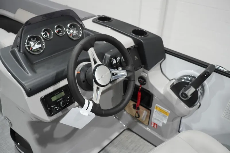 Slide: The Image of Steering console of 2026 Lowe LS 190 boat with gauges and controls. - 26