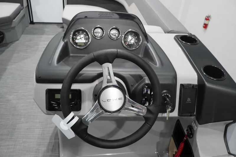 Slide: The Image of Steering console of 2026 Lowe LS 190 boat with gauges and controls. - 27