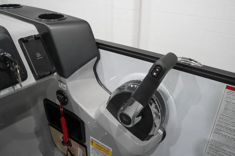 Slide: The Image of Control panel of 2026 Lowe LS 190 boat with throttle and safety features. - 28