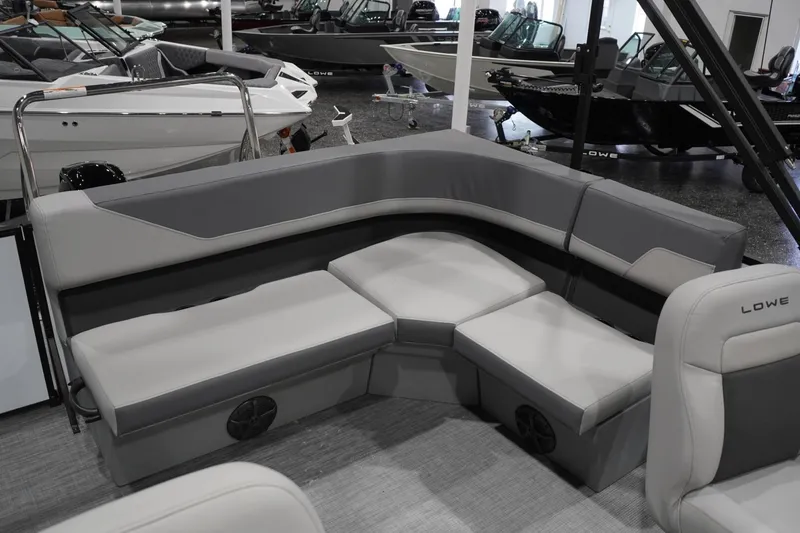Slide: The Image of 2026 Lowe LS 190 boat interior with gray seating in showroom. - 31