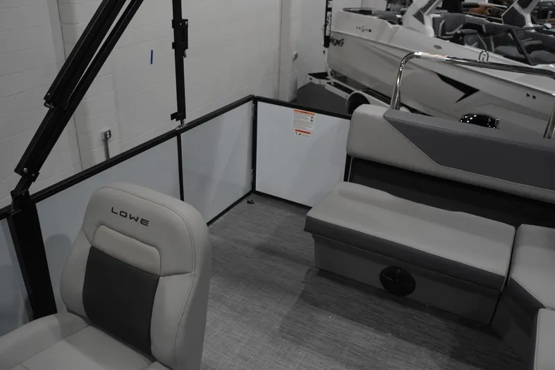Slide: The Image of Interior of 2026 Lowe LS 190 boat with seating and modern design. - 32