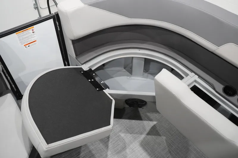 Slide: The Image of Interior seating and storage of 2026 Lowe LS 190 boat, featuring gray upholstery. - 39