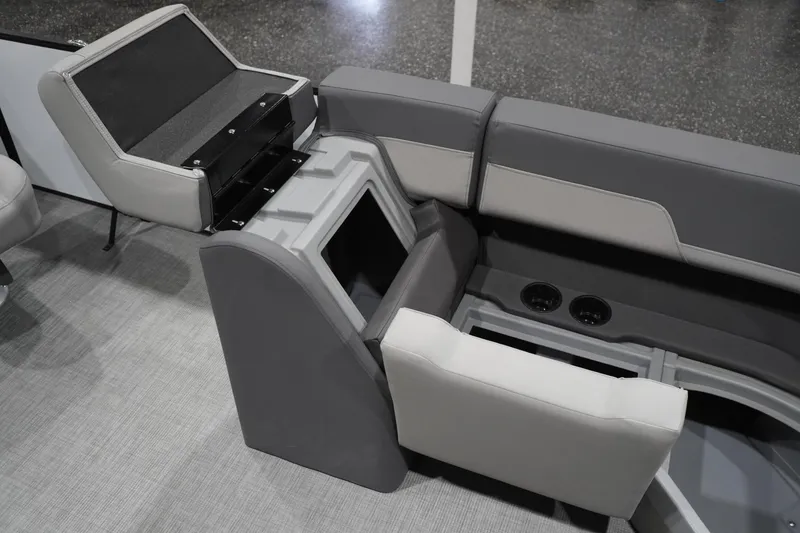 Slide: The Image of Interior seating and storage of 2026 Lowe LS 190 boat, featuring cup holders and gray upholstery. - 42