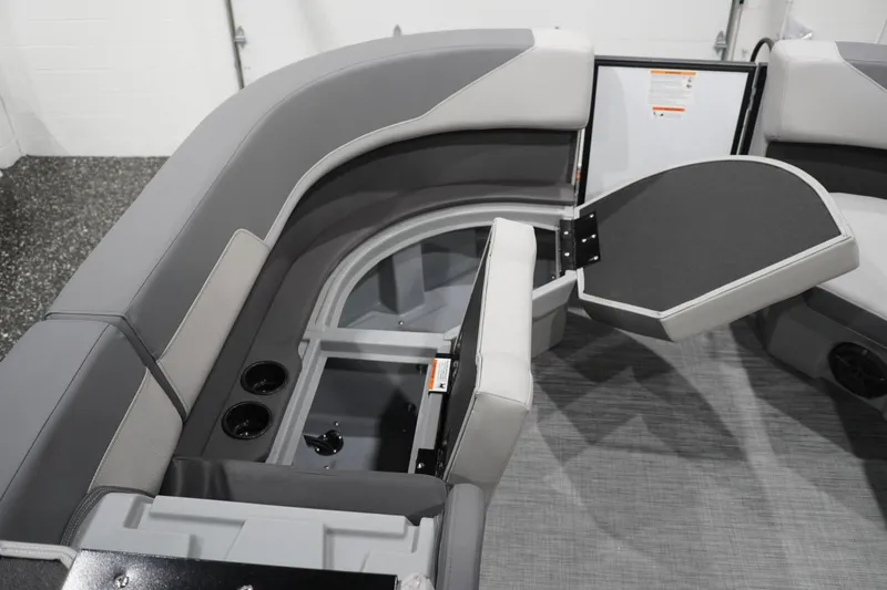 Slide: The Image of 2026 Lowe LS 190 boat interior with open storage compartment and cup holders. - 43