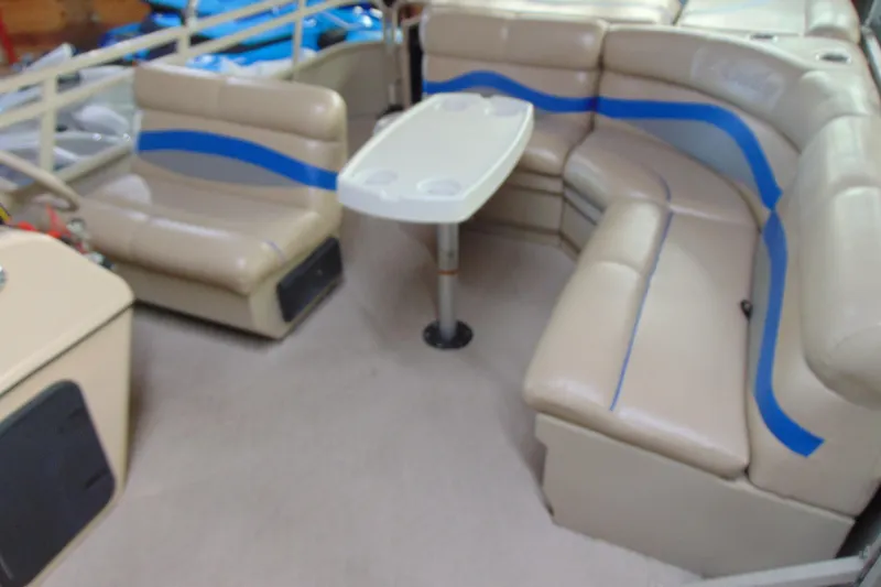 Slide: The Image of Interior of 2010 Bentley Pontoons 220 Fish with beige seating and table. - 11