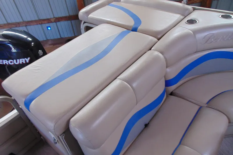 Slide: The Image of 2010 Bentley Pontoons 220 Fish boat interior with beige and blue seating. - 14