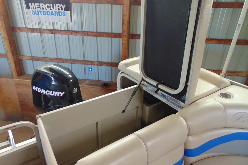 Slide: The Image of 2010 Bentley Pontoons 220 Fish with Mercury outboard motor in storage. - 15