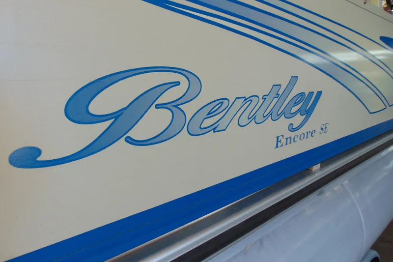 Slide: The Image of 2010 Bentley Pontoons 220 Fish boat with blue logo and design details. - 6