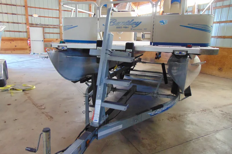 Slide: The Image of 2010 Bentley Pontoons 220 Fish on trailer in indoor storage facility. - 7