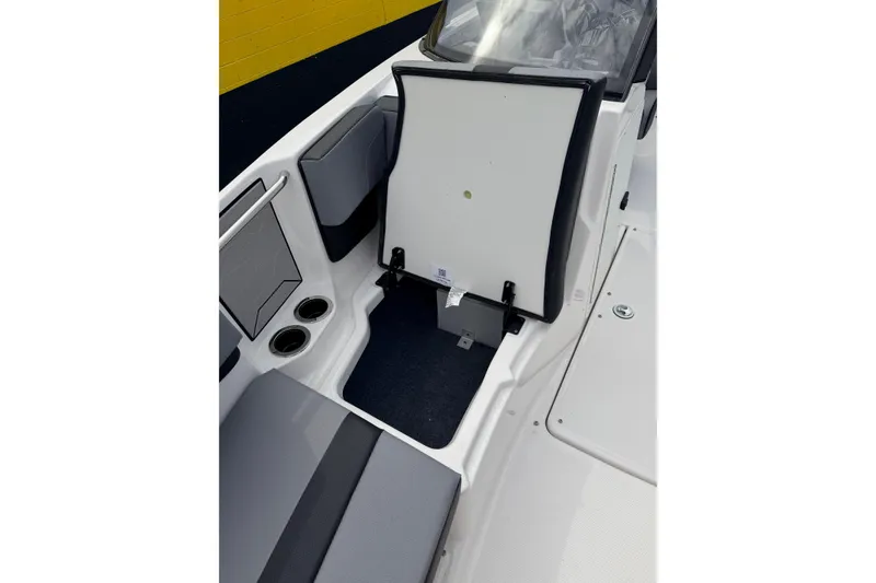 Slide: The Image of Interior of Yamaha Boats 222XD 2026 with seating and storage area. - 12