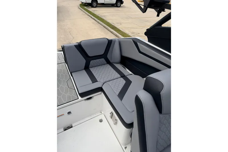 Slide: The Image of Interior of 2026 Yamaha Boats 222XD with gray upholstery. - 14
