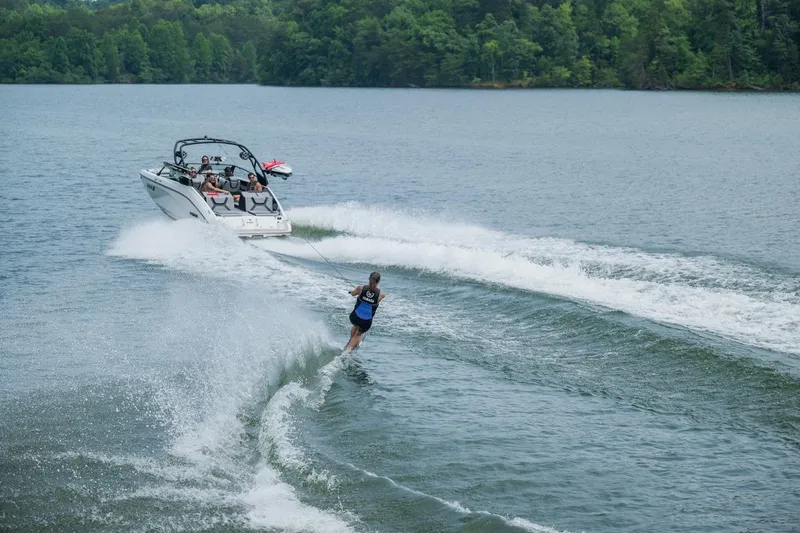 Slide: The Image of Yamaha 222XD boat towing wakeboarder on a lake, 2026 model. - 21