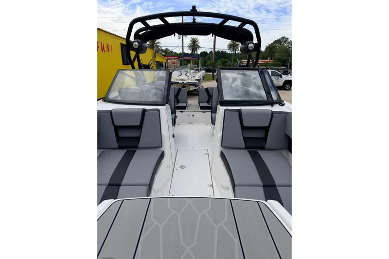 Slide: The Image of Interior view of 2026 Yamaha Boats 222XD with gray seating. - 7