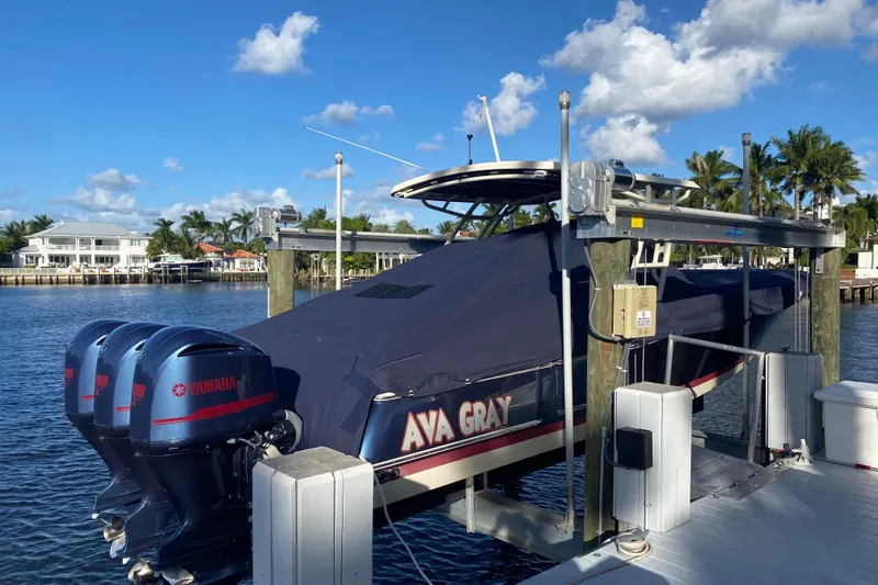 Slide: The Image of 2018 Chris-Craft Catalina 34 boat docked with Yamaha engines, covered and elevated. - 39