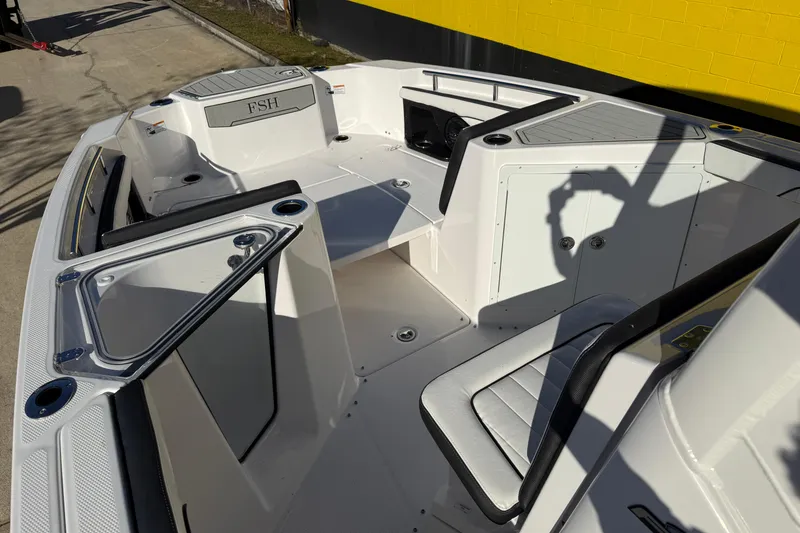 Slide: The Image of 2026 Yamaha Boats 252 FSH Sport interior with seating and storage compartments. - 22
