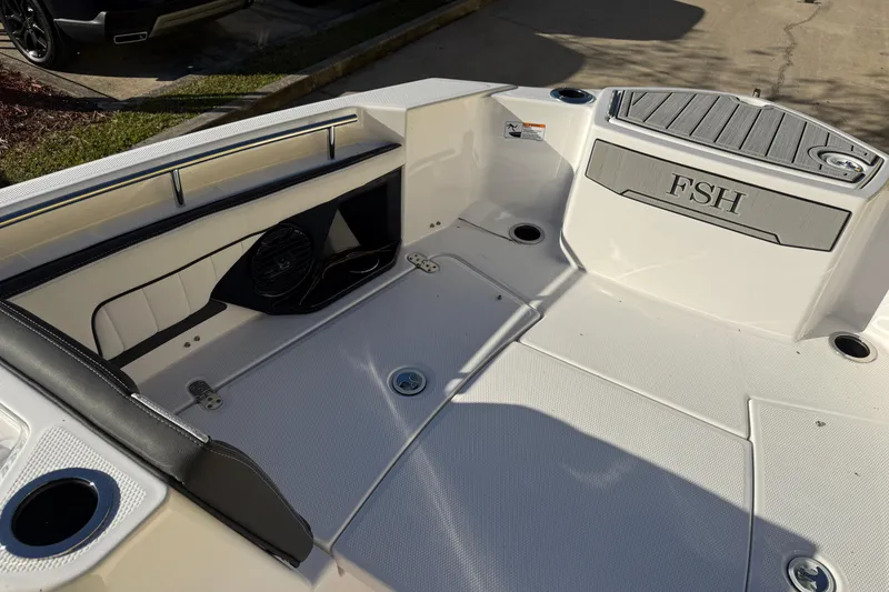 Slide: The Image of 2026 Yamaha Boats 252 FSH Sport interior with seating and storage features. - 27