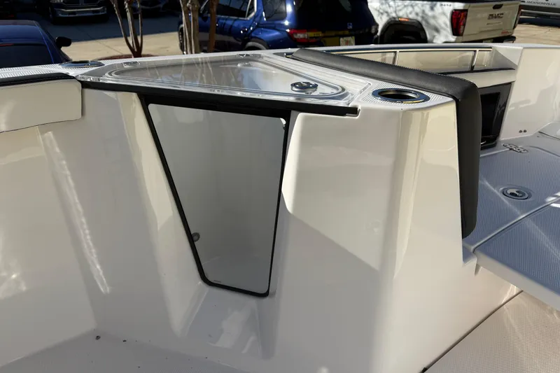 Slide: The Image of 2026 Yamaha Boats 252 FSH Sport interior detail with seating and storage compartment. - 31