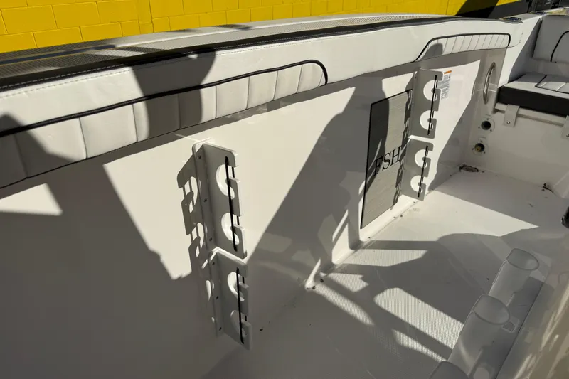 Slide: The Image of Interior view of 2026 Yamaha Boats 252 FSH Sport, featuring rod holders and seating. - 35