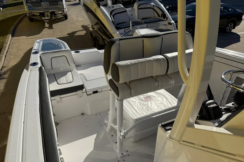 Slide: The Image of 2026 Yamaha Boats 252 FSH Sport interior with seating and steering wheel. - 36