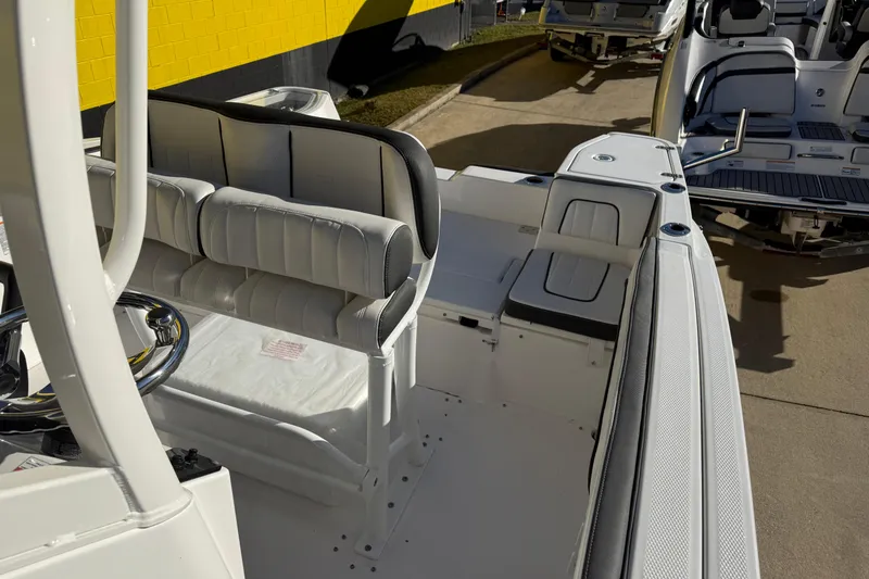 Slide: The Image of 2026 Yamaha Boats 252 FSH Sport interior with seating and steering wheel. - 38