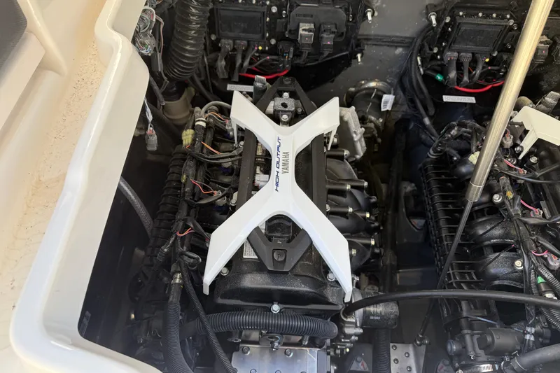 Slide: The Image of Engine compartment of 2026 Yamaha Boats 252 FSH Sport, showcasing dual engines and components. - 43