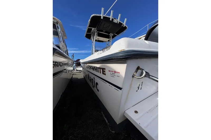 Slide: The Image of 1999 Grady-White Fisherman 222 boat docked under clear blue sky. - 13
