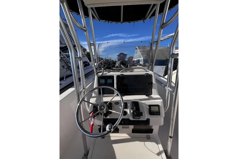 Slide: The Image of 1999 Grady-White Fisherman 222 boat console with steering wheel and navigation equipment. - 5