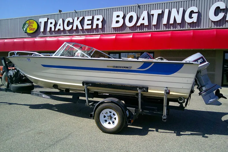 The Image of 1981 Starcraft SuperSport 160 boat on trailer outside Tracker Boating Center. - 1