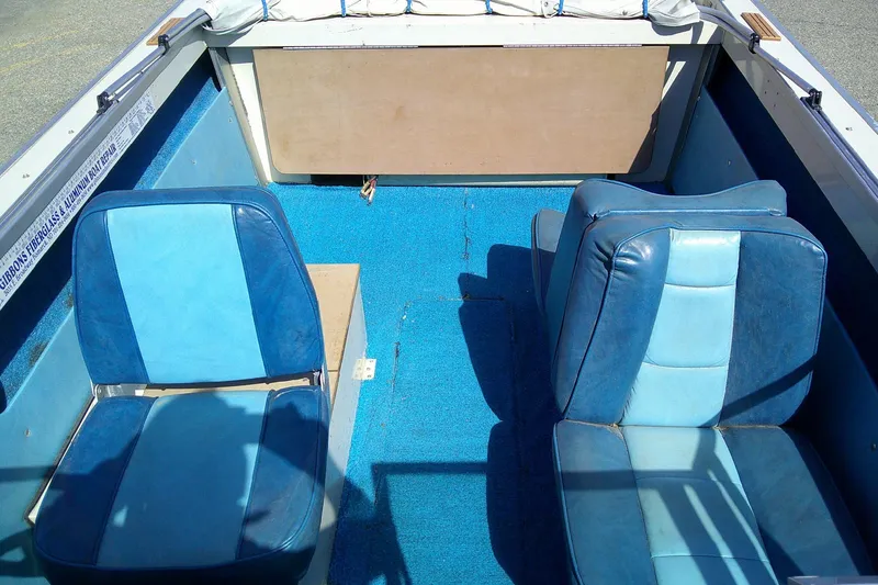 Slide: The Image of 1981 Starcraft SuperSport 160 boat interior with blue seats and carpet. - 10