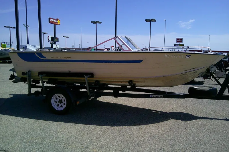 Slide: The Image of 1981 Starcraft SuperSport 160 boat on trailer in parking lot, sunny day. - 4