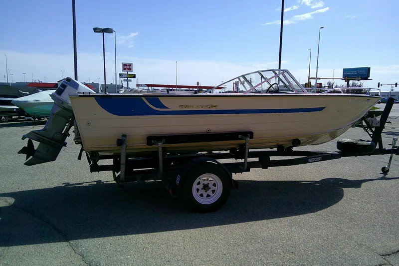 Slide: The Image of 1981 Starcraft SuperSport 160 boat on trailer in parking lot, side view. - 6