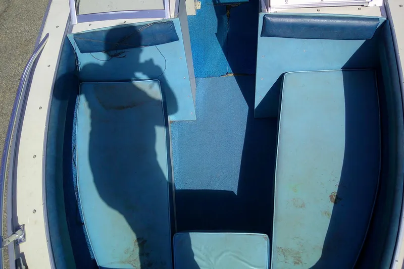 Slide: The Image of 1981 Starcraft SuperSport 160 boat interior with blue seating and shadow. - 9